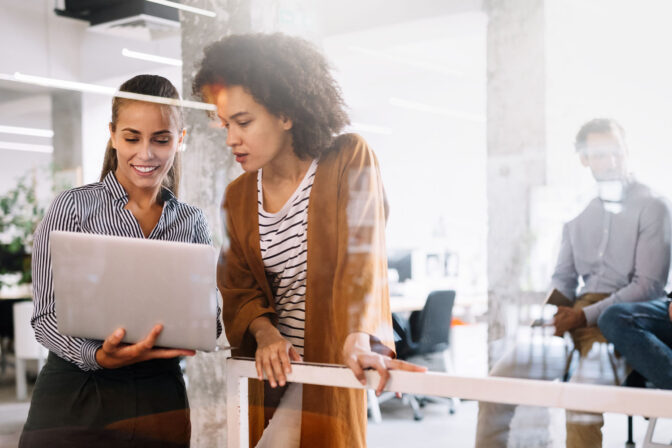 Two Women Looking at Laptop