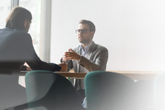 Employees having discussion at a table