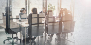 Employees at Conference Table Conducting Tabletop Exercise