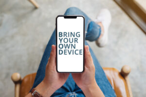 Top view mockup image of a woman holding mobile phone with blank white screen