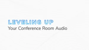 The text "Leveling Up Your Conference Room Audio" on a white and grey background.