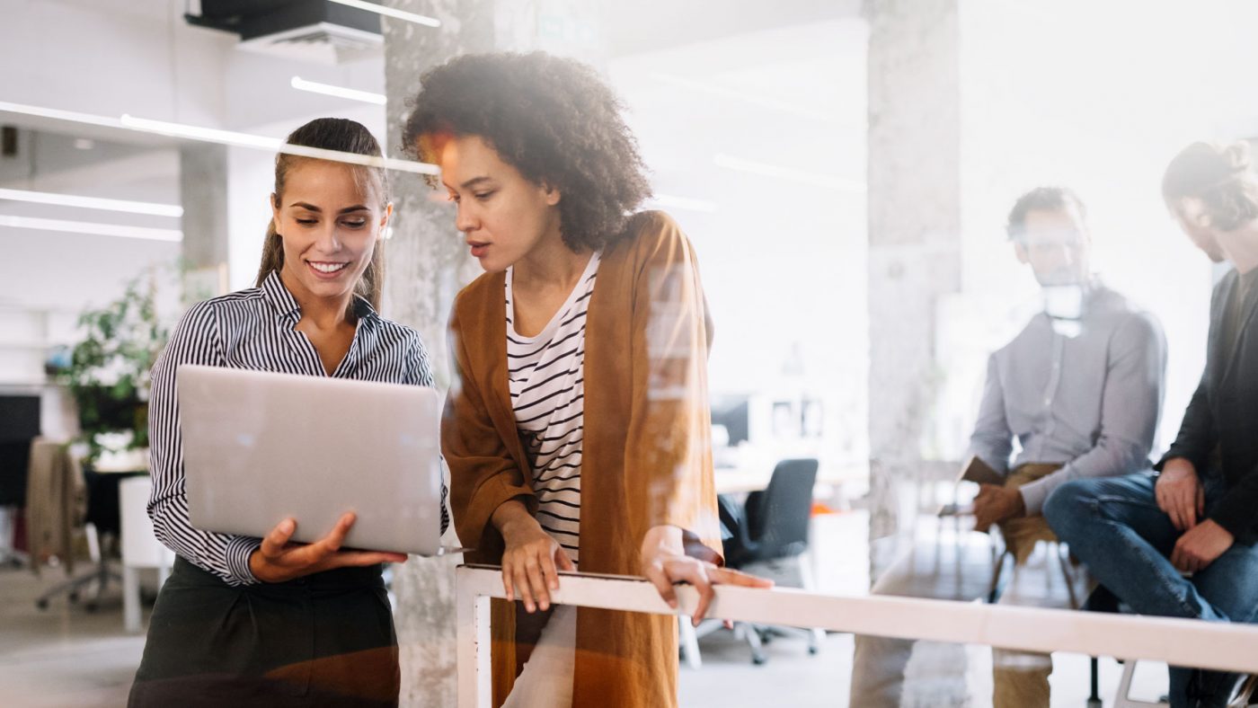 Two Women Looking at Laptop