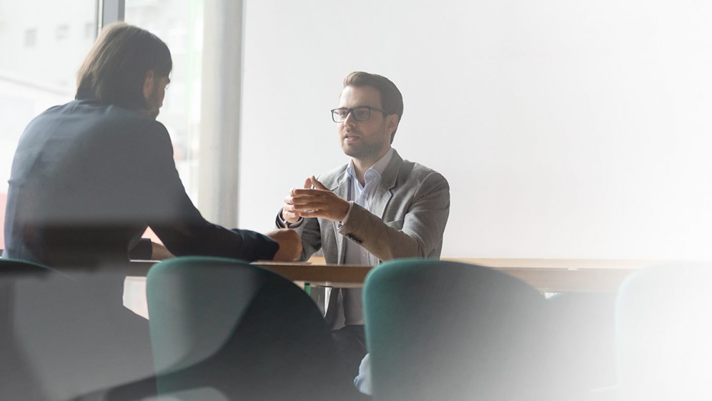 Employees having discussion at a table