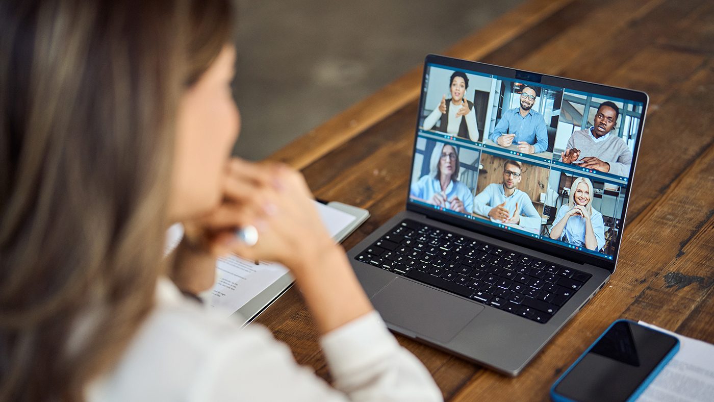 Business woman team leader having hybrid office group meeting video call.